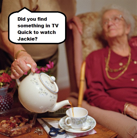Old Lady Sitting in Armchair While Another Lady Pouring Tea